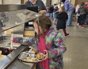 Central-Elementary-Michigan-student-using-stainless-steel-tray