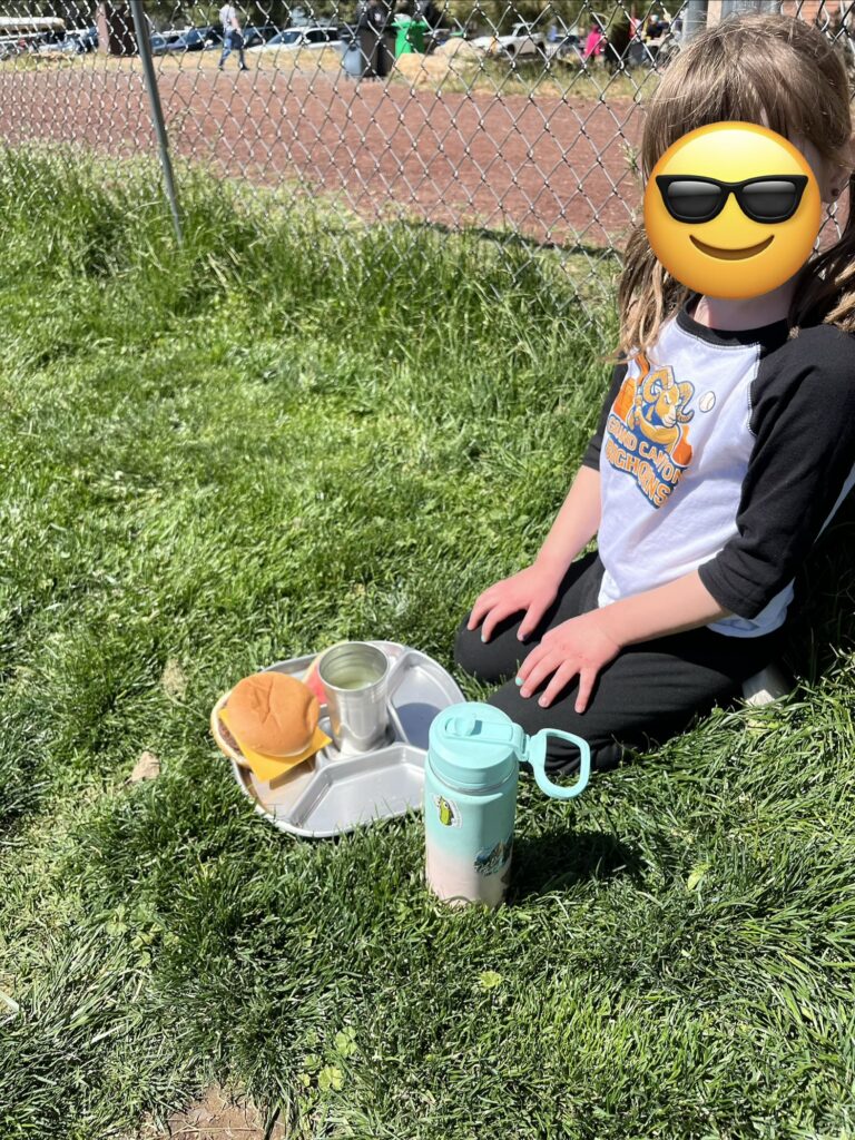 Student at Grand Canyon School using stainless steel tray and cup